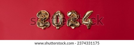 Gilded Beginnings: Embracing 2024 with Golden Foil Numbers on Red