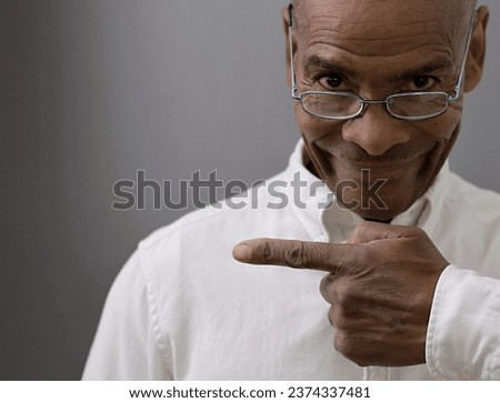 man pointing his finger with dark background with people stock image stock photo