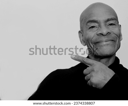 man pointing his finger with dark background with people stock image stock photo
