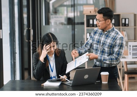 Furious two Asian businesspeople arguing strongly after making a mistake at work in office

 Royalty-Free Stock Photo #2374360209