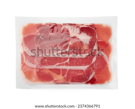 Pack of delicious sliced jamon isolated on white, top view Royalty-Free Stock Photo #2374366791