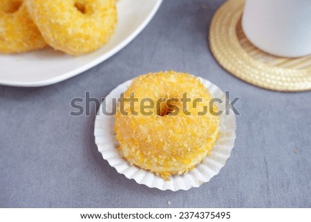 Donat kentang or Potato doughnuts or donuts is a classic recipe for super soft and fluffy doughnuts made using mashed potatoes . selective focus