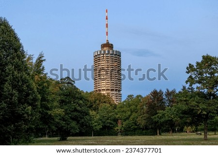 Hotel tower in Augsburg popularly called corncob in Wittelsbacher Park on a summer evening with evening glow Royalty-Free Stock Photo #2374377701