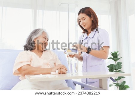 Female doctor takes care healthcare elderly patients with friendliness helping with food willingness encouraging patients to feel good supporting them in recuperating their illnesses in the hospital.