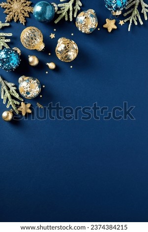 Blue and gold Christmas balls ornaments with fir branches on dark blue background. Xmas poster design, Happy New Year party invitation card template.