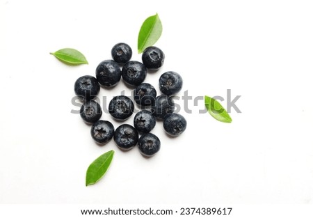 Flat lay composition with tasty Fresh juicy   berries blueberry  on a white backdrop. Healthy eating concept.
organic food, antioxidant, vitamin, blue food. Blueberry pattern.Summer fresh berrie