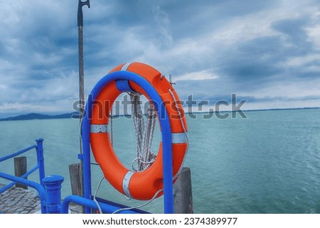 Orange safety buoy on the beach at Balaton,Hungary. High quality photo