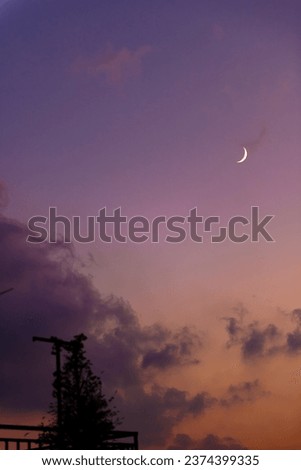 a colorful beautiful sunset picture with a moon
