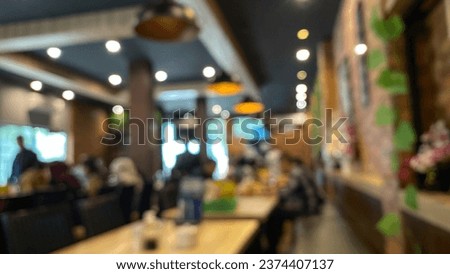 This stunning Indonesian restaurant photograph  table setup, perfect for a cafe or restaurant decor. The bokeh effect in the background adds a touch of magic to the scene