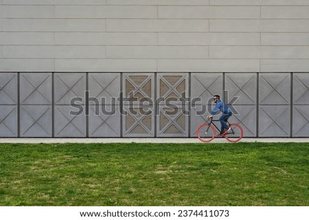 Young man riding a bicycle outdoors