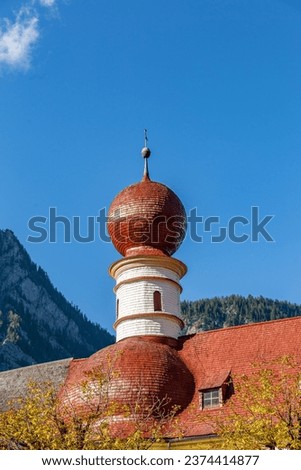 Close-Up of Tower of Church Sankt Bartholomae on the shore of Lake Königssee, Germany, Europe Royalty-Free Stock Photo #2374414877