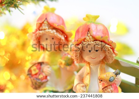 Lovely doll with Christmas Trimmings and Christmas Lights on white background