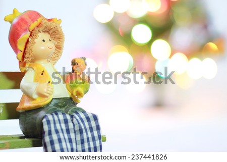 Lovely doll with Christmas Trimmings and Christmas Lights on white background