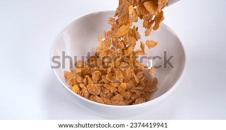 Cereals falling into a Bowl