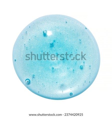 Blue lip gloss juicy texture isolated on white background. Smudged cosmetic product smear. Makup swatch product sample Royalty-Free Stock Photo #2374420925