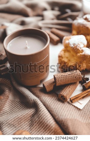 Candle and sweet cookies, aesthetic photo.