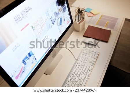 Website, planning and a computer screen in an office, table or workspace connection. Strategy, business and a desktop pc at a desk for company information, web design or online graphic creativity