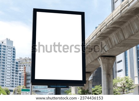 Outdoor pole vertical light box billboard with mock up white screen. Clipping path for mock up