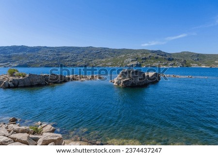 Lagoa Comprida (Long Lake) is the largest lake of Serra da Estrela Natural park, Portugal. Royalty-Free Stock Photo #2374437247
