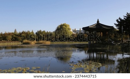 Blue sky and lake park, octagonal pavilion, nature Korea Royalty-Free Stock Photo #2374443715