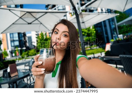 Photo of joyful good mood girl drinking cappuccino in restaurant break pause weekend sunny weather outdoors