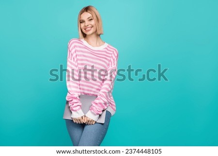 Photo of cheerful cute lady wear pink pullover holding modern device empty space isolated turquoise color background
