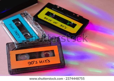Retro cassettes with 90's music, disco party lights, 90's party concept