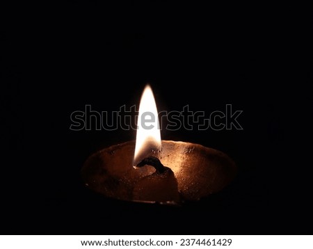 A beautiful picture of ghee lamp with isolated black background Diwali Diya
Indian Traditional Deepak Fire. Every morning and evening ghee lamp is fire for the worship of God in India.