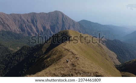 Mount Rinjani is an active volcano in Indonesia on the island of Lombok. Administratively the mountain is in the Regency of North Lombok, West Nusa Tenggara. It rises to 3,726 metres, 