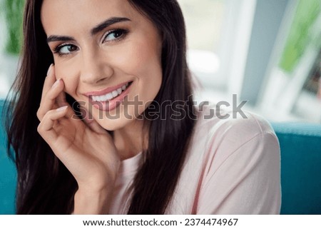 Close up cropped photo of cute positive girl beaming smile arm touch cheekbone enjoy free time indoors