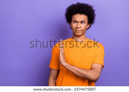 Photo of strict young guy chevelure orange trendy t shirt hand decline disagree with new government isolated on purple color background