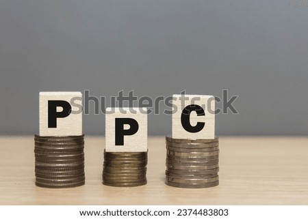 Wood cube stack alphabet PPC abbreviation on white background.
Pay Per Click Advertising website Concept.