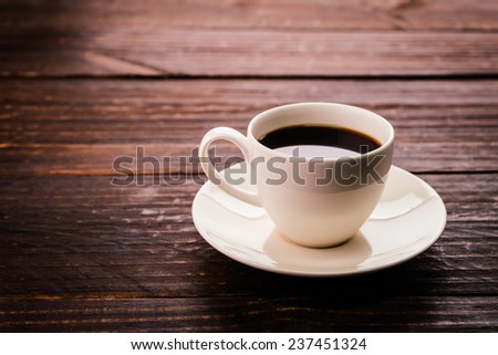 Coffee cup on wooden background - Vintage effect style pictures