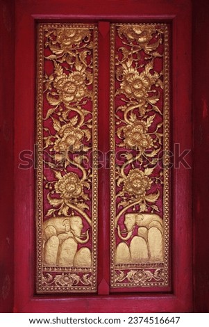 The architecture of the windows of the temple Decorated with carved patterns. Wat Meun Na and Vat Mounena Somphouaram, Luang Prabang, Lao