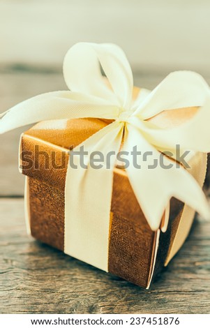 Gift box on wooden table - Vintage effect style pictures