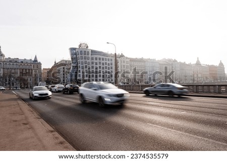 Prague's Iconic Dancing House with cars Passing By