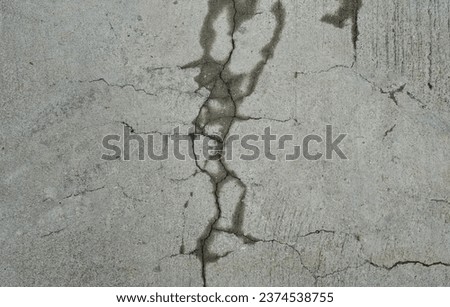 cracked cracks in a concrete floor..