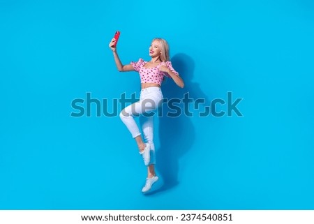 Full length photo of lovely young lady selfie photo thumb up dressed stylish pink cherry print garment isolated on blue color background