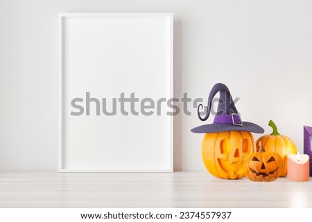 Happy Halloween composition with pumpkin and frame mockup for text or art presentation. The frame is prepared for Halloween in October. Thanksgiving, October and autumn, for Halloween concept.