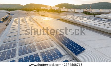 Solar Panels on Warehouse Factory. Solar photo voltaic panels system power or Solar Cell on industrial building roof for producing green ecological electricity. Production of renewable energy. 