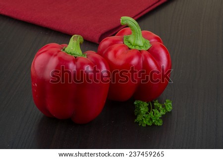 Red Bulgarian bell pepper on the wooden background