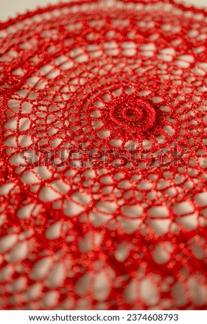 Red crochet doily. This photo has been taken in Prague, 2023