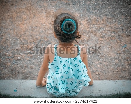 Young little girl best ai editing photo with awesome filter effect. Kid playing in garden on swinging.