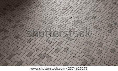 Cobblestone or pavement texture with a shallow depth of field for perspective background