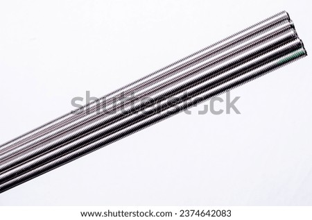 Many Metal Steel bars DIN 975 close up 