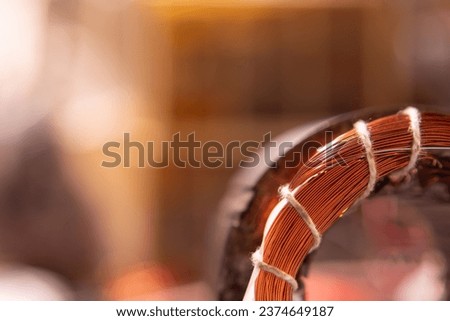 Take pictures of the motor that is winding the copper coil in the macro range