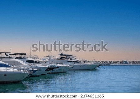Luxury yacht marina. Vacations And Tourism Concept, Beautiful white modern yachts at sea port. Royalty-Free Stock Photo #2374651365