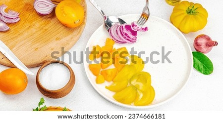 A woman is preparing a tomato salad. Ripe vegetables, herbs, aromatic spices, olive oil. Home cooking, fresh ingredients, banner format
