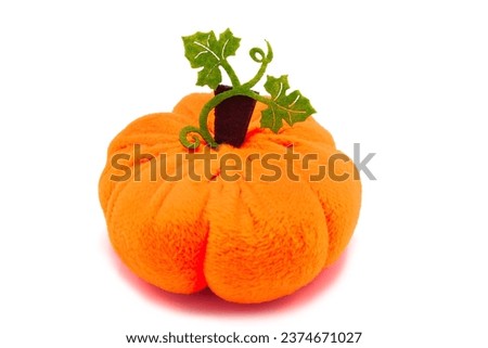 Decorative toy interior decoration pumpkin isolated on a white background.