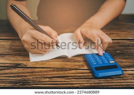 Woman hand press calculator, business concept.